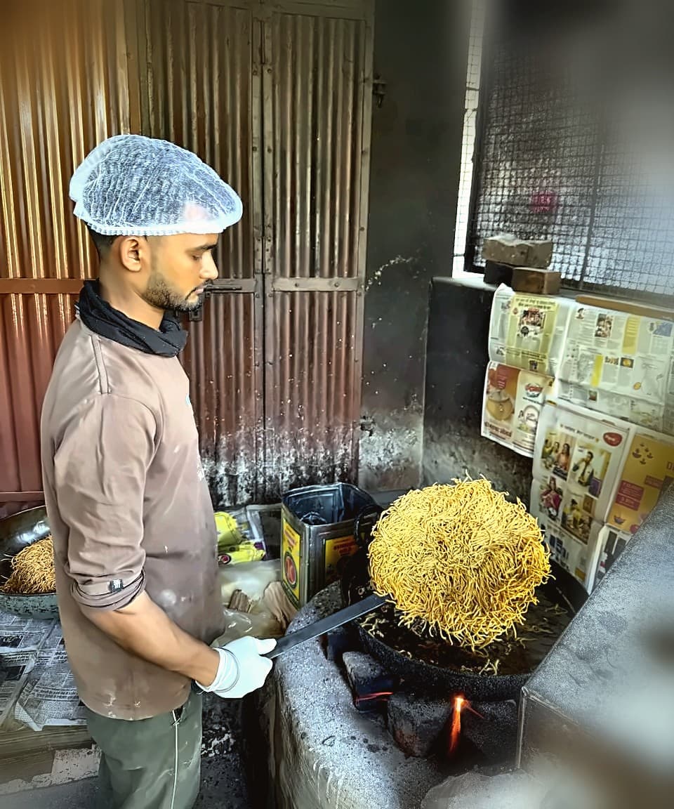 Rajguru Snacks — hairnet and gloves, hygiene at every step
